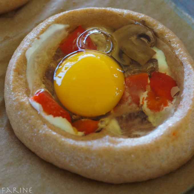 Garnish with cheese and roasted red peppers and add egg
